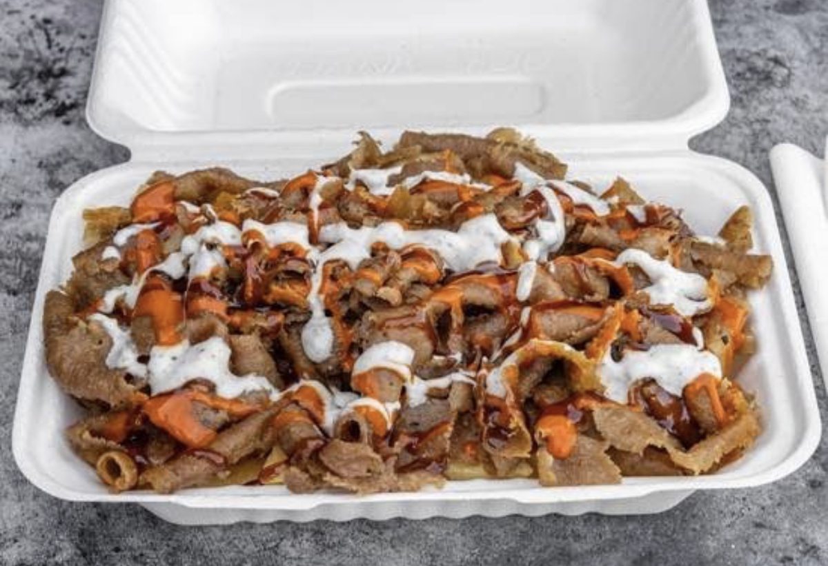 A loaded halal snack pack with garlic, chilli and BBQ sauce